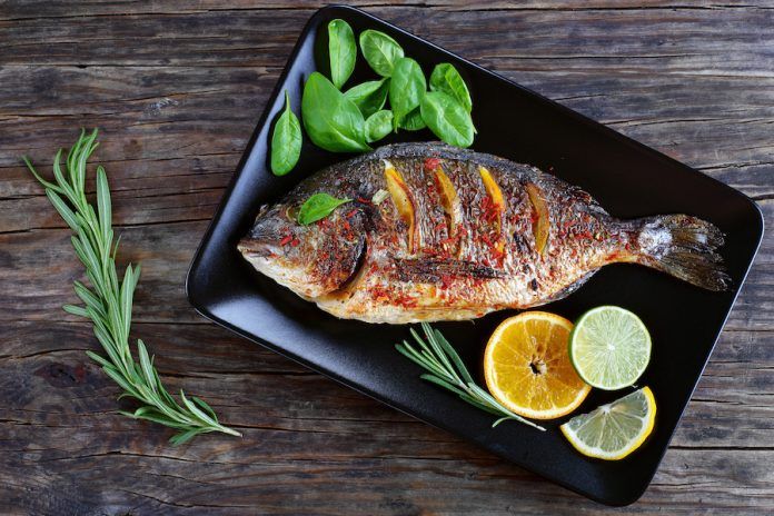 Grilled Whole Fish On Black Plate