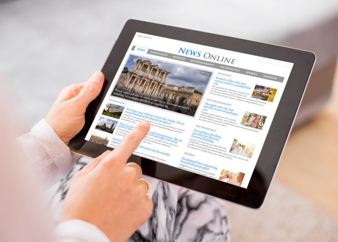 Sample News Website On Digital Tablet. Contents Are All Made Up.