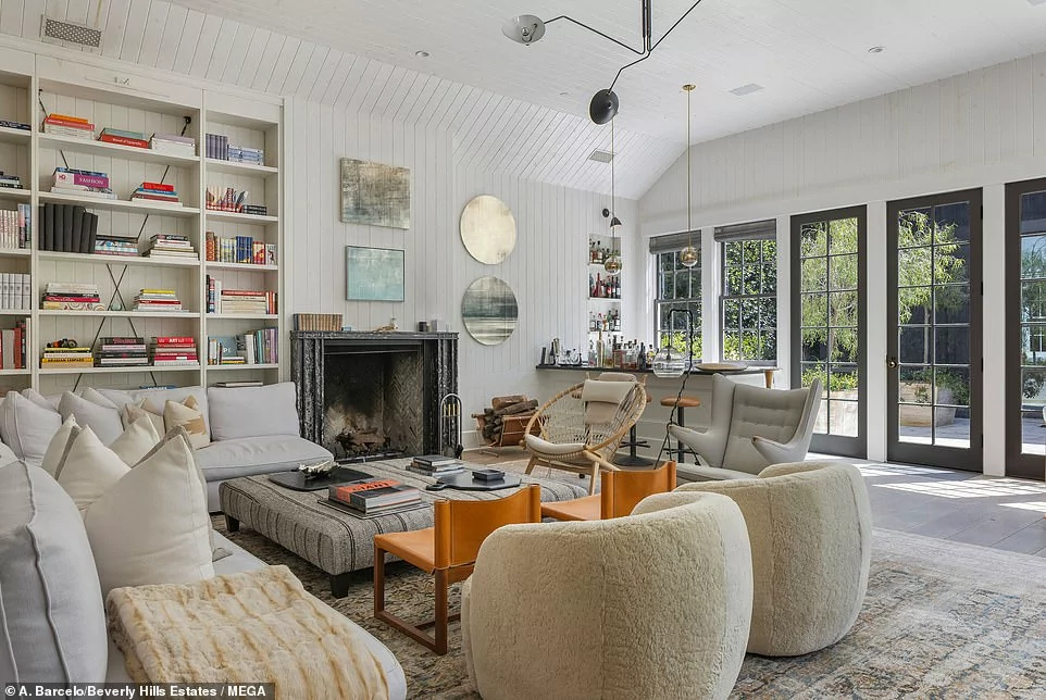 85679673 13491549 The_living_room_is_ideal_for_hosting_with_a_wood_burning_firepla A 4_1717473053189